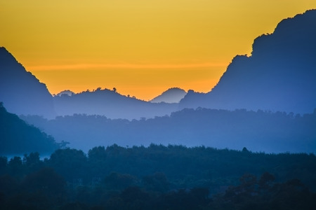 Overlapped mountain range, silhouette style photoの写真素材