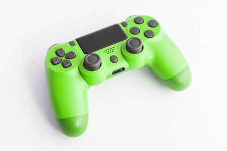 A joystick controller on the white isolated background, green colored