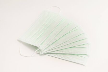 A medical mask on white isolated backgroundの写真素材