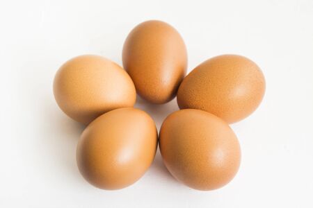 The five eggs on the white isolated backgroundの写真素材