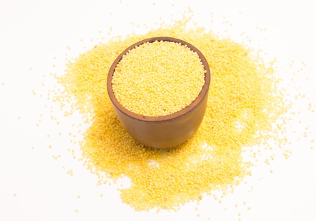 millet groats diet supplements isolated on whiteの写真素材