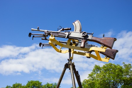 machine gun on a tripod against the blue skyの写真素材