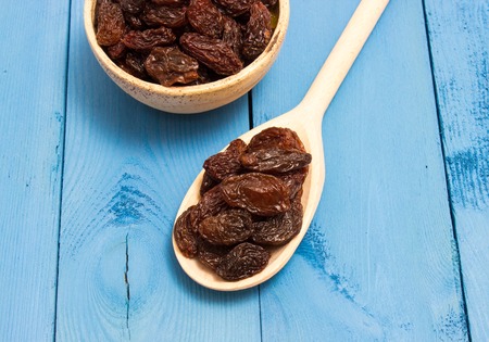 the raisins on a blue board closeupの写真素材