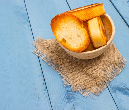 croutons on a canvas and blue board closeupの写真素材
