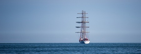 departing ship on a background of blue sky