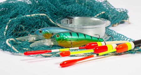 bait, wobbler and fishing accessories isolated on white