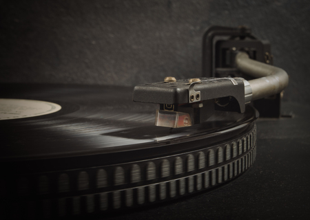 Black vinyl on the record player. CloseUp