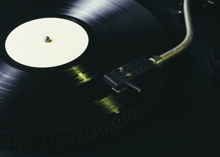 Black vinyl on the record player. CloseUpの写真素材