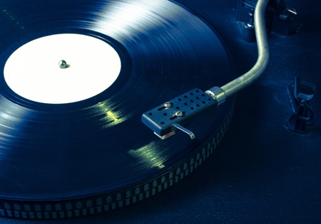 Black vinyl on the record player. CloseUpの写真素材