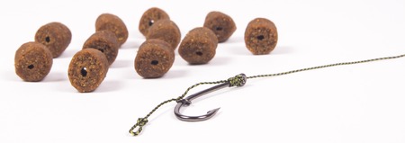 Close Up of Carp Hook pellets isolated on white background .の写真素材