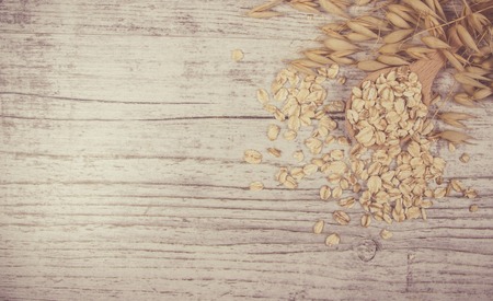 Raw oatmeal . Healthy eating concept .