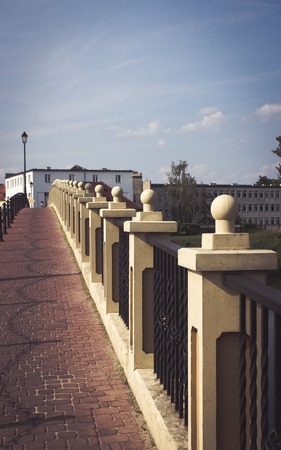 Konin, Poland - July 22, 2017: View on bridge and embankment of Warta river in polish town Konin, Greater Poland provinceの写真素材