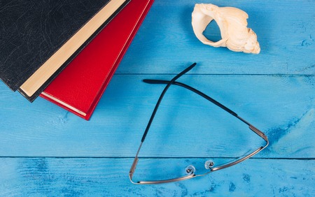 Book with glasses on the wooden background. Education concept.の写真素材