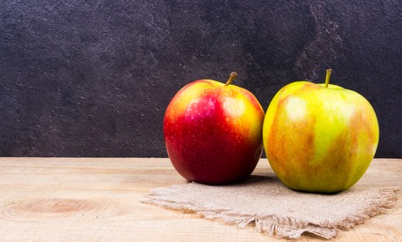 Fresh apple on a wooden background. Healthy eating concept.の写真素材