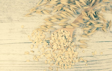 Raw oatmeal . Healthy eating concept .