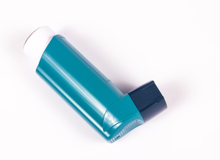 Inhaler to treat asthma on a white background.の写真素材