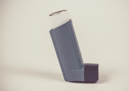 Inhaler to treat asthma on a white background.の写真素材