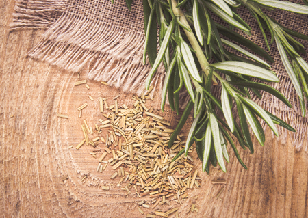 Bunch of green scented rosemary on rustic background.の写真素材