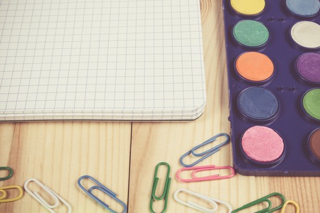 School supplies on wooden background. A place for your inscription.