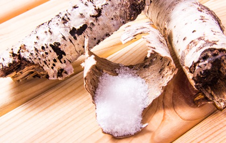 Xylitol - sugar substitute for diabetics. Birch sugar on wooden background.の写真素材
