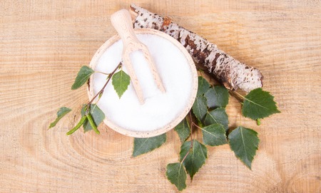 Xylitol - sugar substitute for diabetics. Birch sugar on wooden background.の写真素材