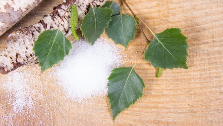 Xylitol - sugar substitute for diabetics. Birch sugar on wooden background.の写真素材