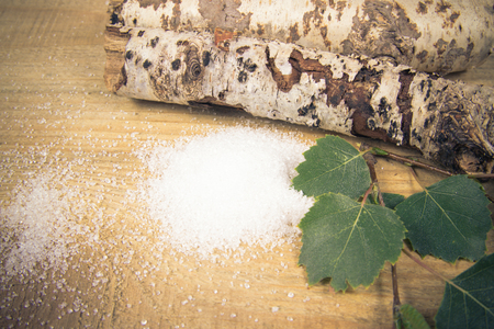 Xylitol - sugar substitute for diabetics. Birch sugar on wooden background.の写真素材