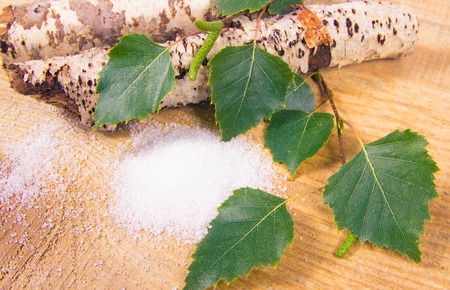 Xylitol - sugar substitute for diabetics. Birch sugar on wooden background.の写真素材