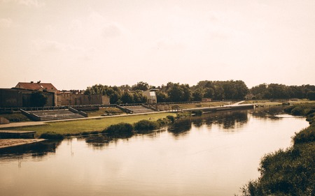 Konin, Poland - July 22, 2017: View on embankment of Warta river in polish town Konin, Greater Poland province.のeditorial素材