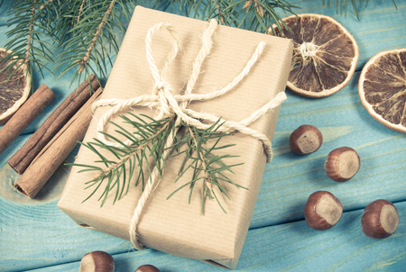 Christmas gifts in rustic decorative boxes on wooden background. Close Up.の写真素材