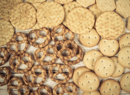 Mix of snacks : pretzels, crackers, cookies. Close Up.の写真素材