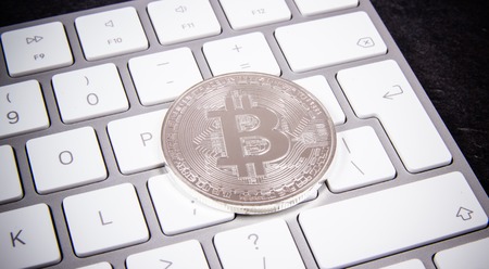 Bitcoin coin - symbol of crypto currency. Concept of electronic virtual money for web banking and international network payment.の写真素材