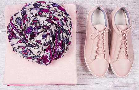 Pink color female clothes on light background. Fashion women's accessories and wear.の写真素材