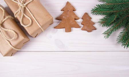 Christmas composition, Gifts, tree branches, decorations on wooden background. A place for an inscription.の写真素材