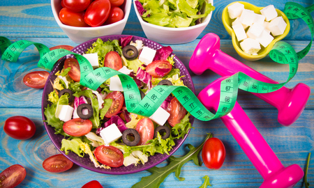 Conception of healthy eating. Fresh vegetable salad with feta cheese.の写真素材