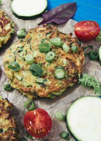 Vegetarian food - zucchini fritters on wooden background.の写真素材