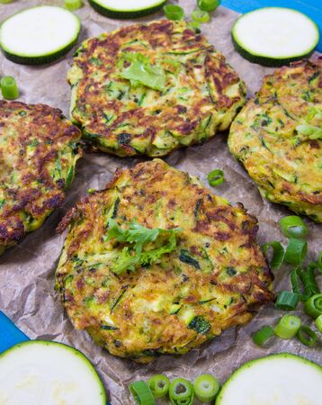 Vegetarian food - zucchini fritters on wooden background.の写真素材