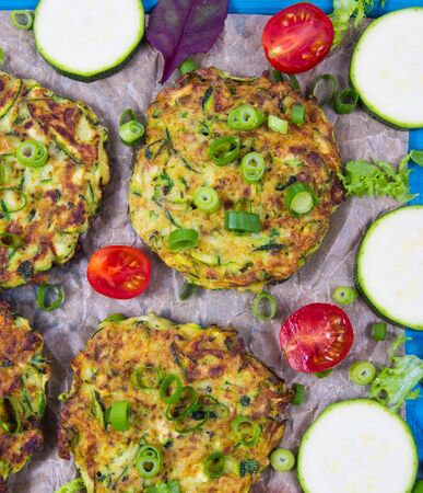 Vegetarian food - zucchini fritters on wooden background.の写真素材