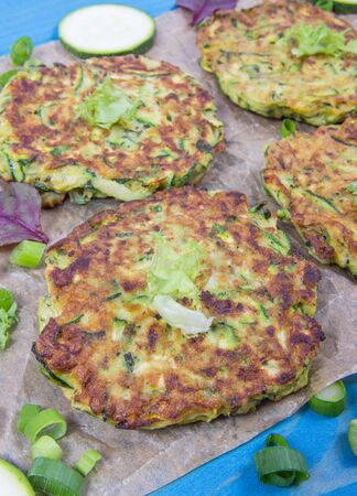 Vegetarian food - zucchini fritters on wooden background.の写真素材