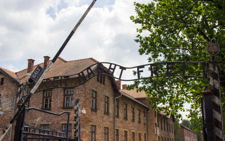 Auschwitz-Birkenau, Poland - June 27, 2019 The inscription ,, Arbeit macht frei ,, of the German concentration camp Auschwitz.のeditorial素材