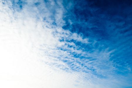 blue sky background with light clouds on the horizonの写真素材