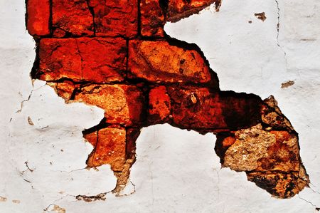 old brick wall with white stucco, backgroundの写真素材
