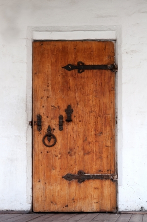 old closed wooden door, a stone buildingの写真素材