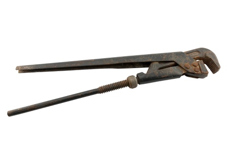 Big old adjustable extension wrench isolated on whiteの写真素材