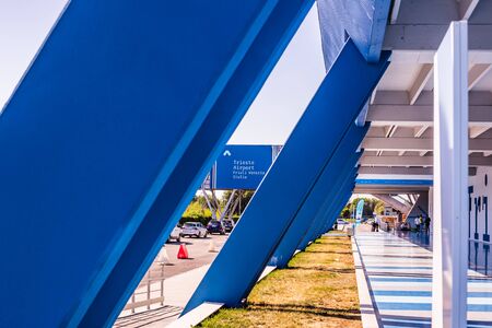 Trieste, Italy - 09-15-2019: Entrance of the Trieste Airport with the departure gates, security control, shops and luggage claim.のeditorial素材