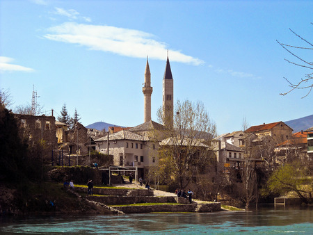 Mosque minaret and catholic church bell-tower. Mostar.  Bosnia and Herzegovinaの写真素材