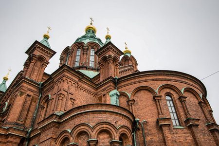 Close detail of Uspenski Orthodox Cathedral, with grey sky in the background, Helsinki, Finland