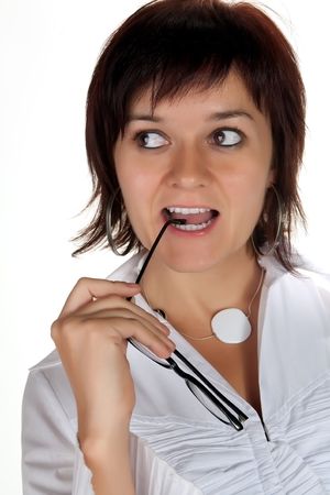 Young businesswoman with glasses wearing white shirtの写真素材