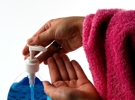 Handsoap squeezed into hand isolated on the white backgroundの写真素材