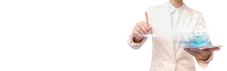 A person in a white sleeveless top and light-colored pants holds a pair of shoes and a small clutch bag.の写真素材